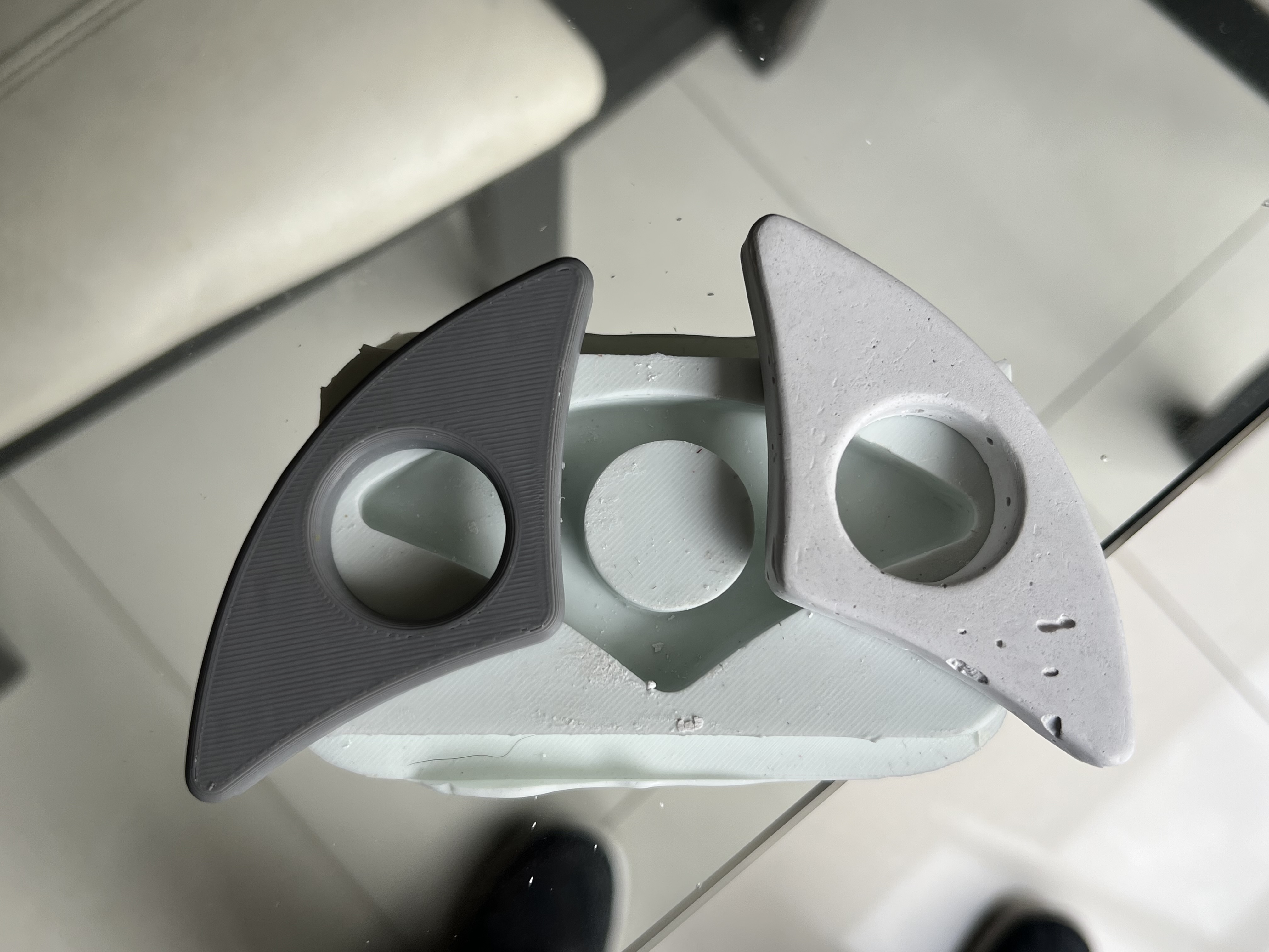Plaster of Paris poured into the silicone mold and leveled flat with a spatula